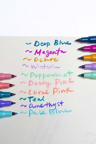 Pastel brush pen set showing multiple colorful marker bodies and tips