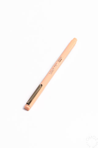 Pastel peach pen with silver tip and clip.
