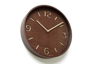 Brown round wall clock with gold hour markers and thin clock hands