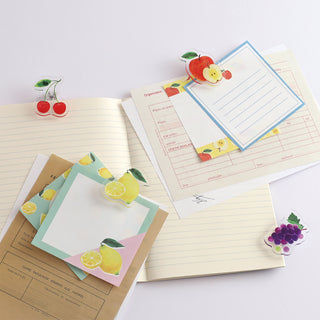 Cherry motif acrylic paper clip with two red cherries on stationery pages