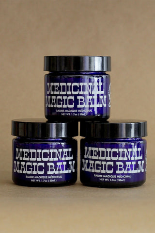 CBD medicinal magic balm jars with black lids, purple labels, 3 jars