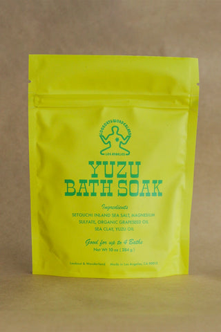 Lime yellow bath soak pouch with green Yuzu Bath Soak label