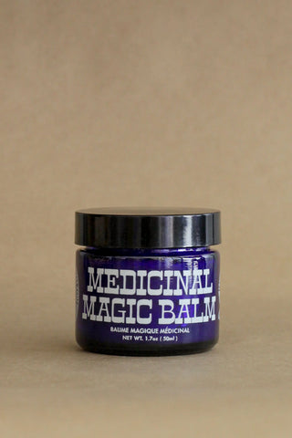 CBD medicinal magic balm jar with black lid and purple front label