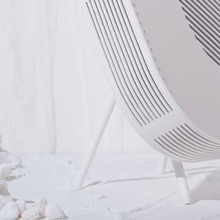 Löv air purifier in cream white with cradle stand, partial side view