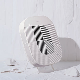 Löv air purifier with cradle stand in cream white, rounded vented front