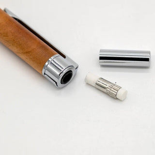 Wooden mechanical pencil close-up of metal barrel and retractable lead tip