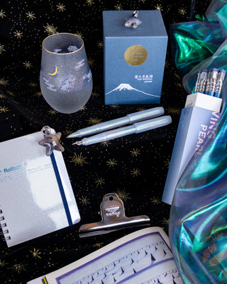 Iridescent pearl rollerball pen with light-blue translucent barrel and clip