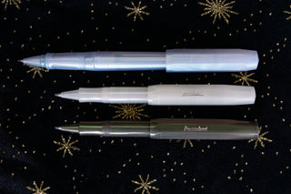 Three Kaweco Lunar Sport rollerball pens in light green, blue, and gray