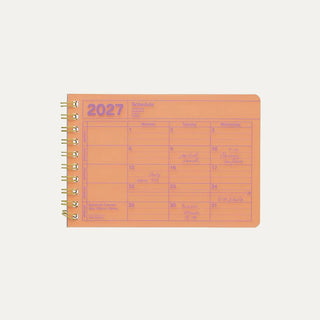 Orange 2027 notebook calendar cover showing a weekly schedule page and spiral rings