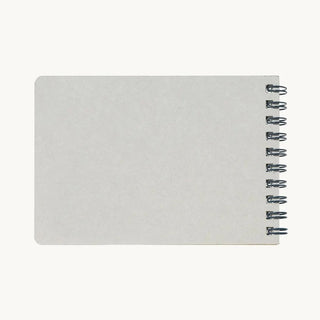 Blank cover back of a small 2027 notebook calendar with visible spiral rings