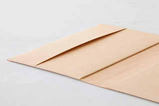 A5 square notebook cover, beige paper hard with stitched edge; folded-over view