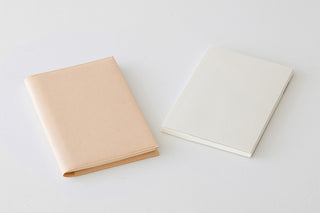 A5 square notebook covers, tan and cream exteriors, shown side by side