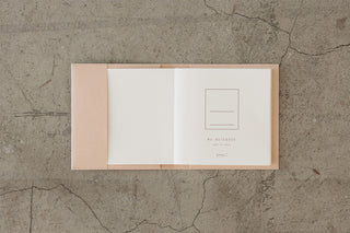 A5 square notebook cover, beige exterior with cream interior spread and label