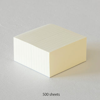 Cream and white lined memo pad block, three-sided view