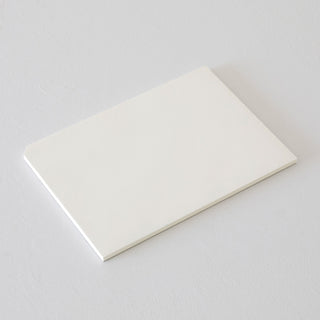 Cotton paper pad, closed off-white pages with clean cover