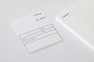 White cotton notebook cover set of two cards showing “IDEA DIARY”