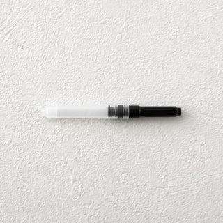 MD fountain pen converter with clear barrel, black section, and white tip