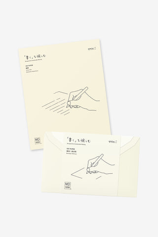 Cream MD letter pad page and matching envelope with minimal line illustration
