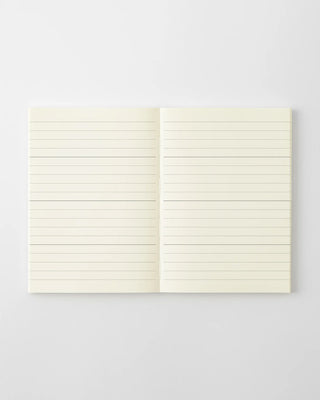 MD 2027 monthly planner notebook open to blank lined pages, two-page spread