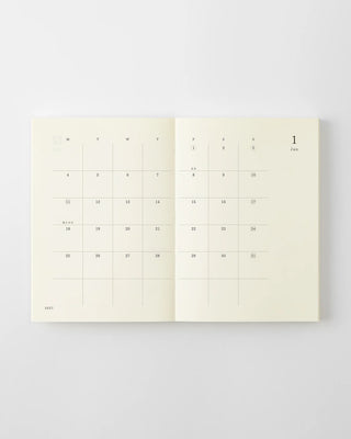 MD 2027 monthly planner notebook open to month calendar grid with dates