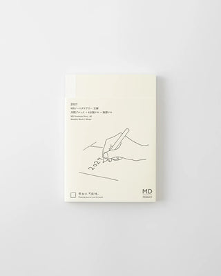 Monthly planner cover in cream with line-art hand illustration and MD logo