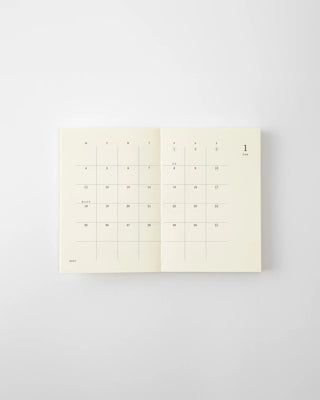MD 2027 monthly planner notebook open to calendar grid with numbered days