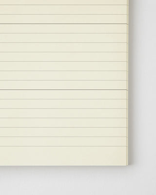 MD notebook page close-up with horizontal ruled lines and clean margins