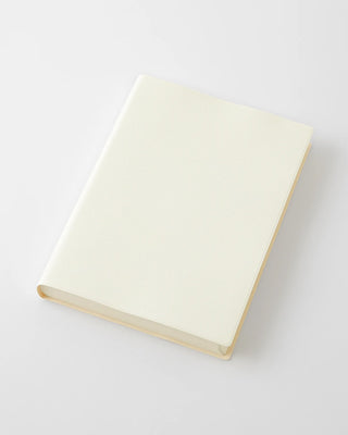Cream page-a-day planner with closed cover and rounded corners