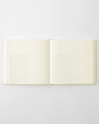 Open page-a-day planner with lined day sections and margin grid marks
