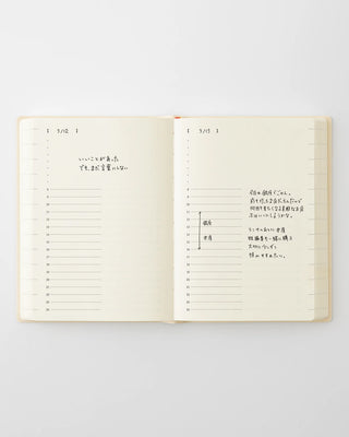Open page-a-day planner with handwritten notes on dated daily lines
