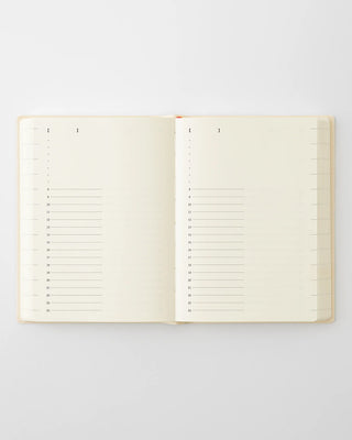 Open page-a-day planner showing ruled monthly grid pages