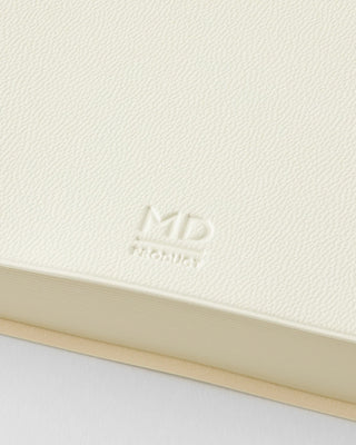 White page-a-day planner notebook cover with embossed MD logo