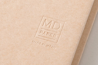 Beige notebook cover with embossed MD PAPER and MADE IN JAPAN