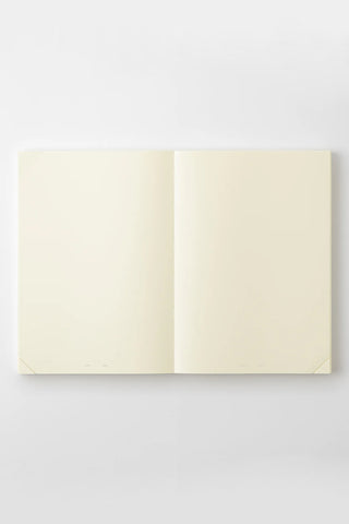 Open A5 page-a-day journal notebook showing two blank cream pages