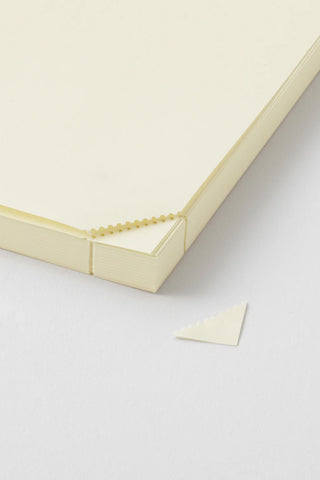 Cream A5 journal notebook with stitched edge and loose note page