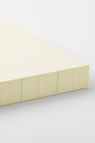 Cream A5 page-a-day journal spine with ribbed cover edge and stitching lines