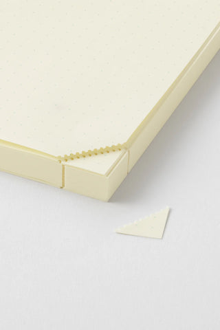 Cream A5 page-a-day journal with dotted cover page and elastic spine detail