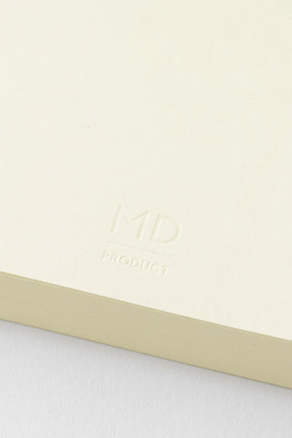Cream A5 journal cover with embossed MD logo and subtle product text