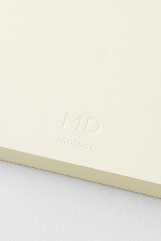 Cream notebook cover with embossed MD branding