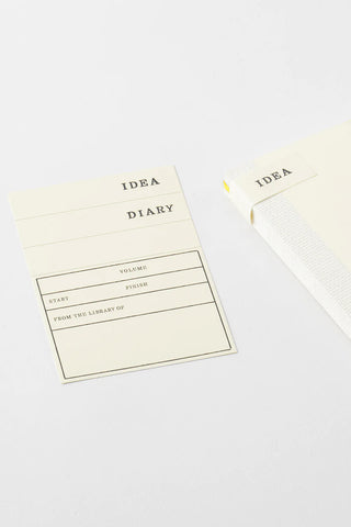 Cream notebook cover insert labeled IDEA DIARY with volume lines