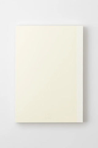 Cream dot grid notebook single sheet view with faint MD logo