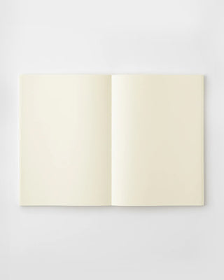 Open cream notebook showing two blank pages