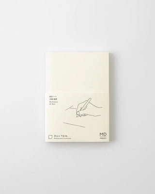 MD blank notebook, cream cover with line-art sketch and MD logo on front.