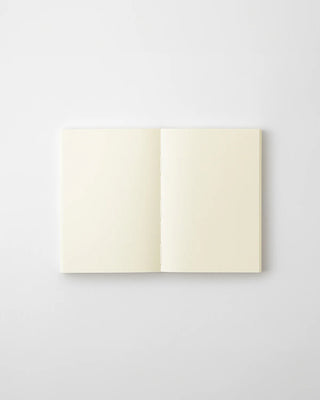 Open cream MD blank notebook, two blank pages shown, centered on spine.