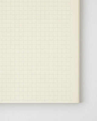 Close-up of MD grid notebook page, light grid lines and spacing markers