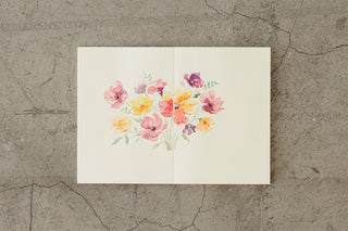 Thick notebook with floral bouquet cover print on a white background