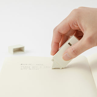 Correction tape dispenser, 5mm white, held by hand for paper correction