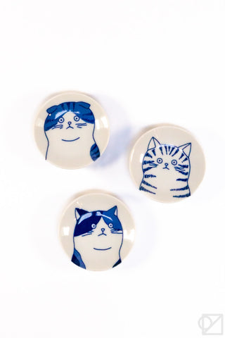 Set of three ceramic cat face dishes with blue-and-white cat designs