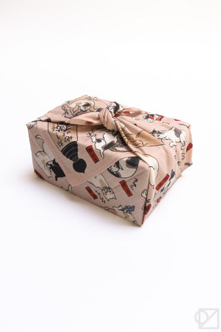 Kuniyoshi cats furoshiki folded into a compact square, with cat illustrations and red seals