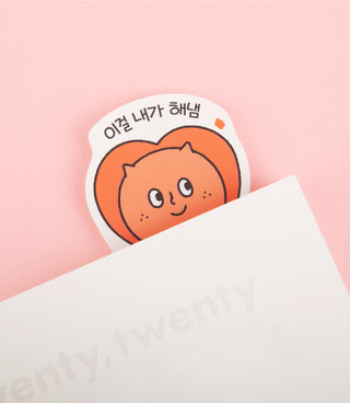 Removable sticker pack featuring an orange smiling cat face sticker on a sheet